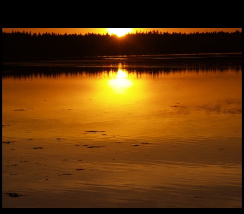 Sunset over calm water