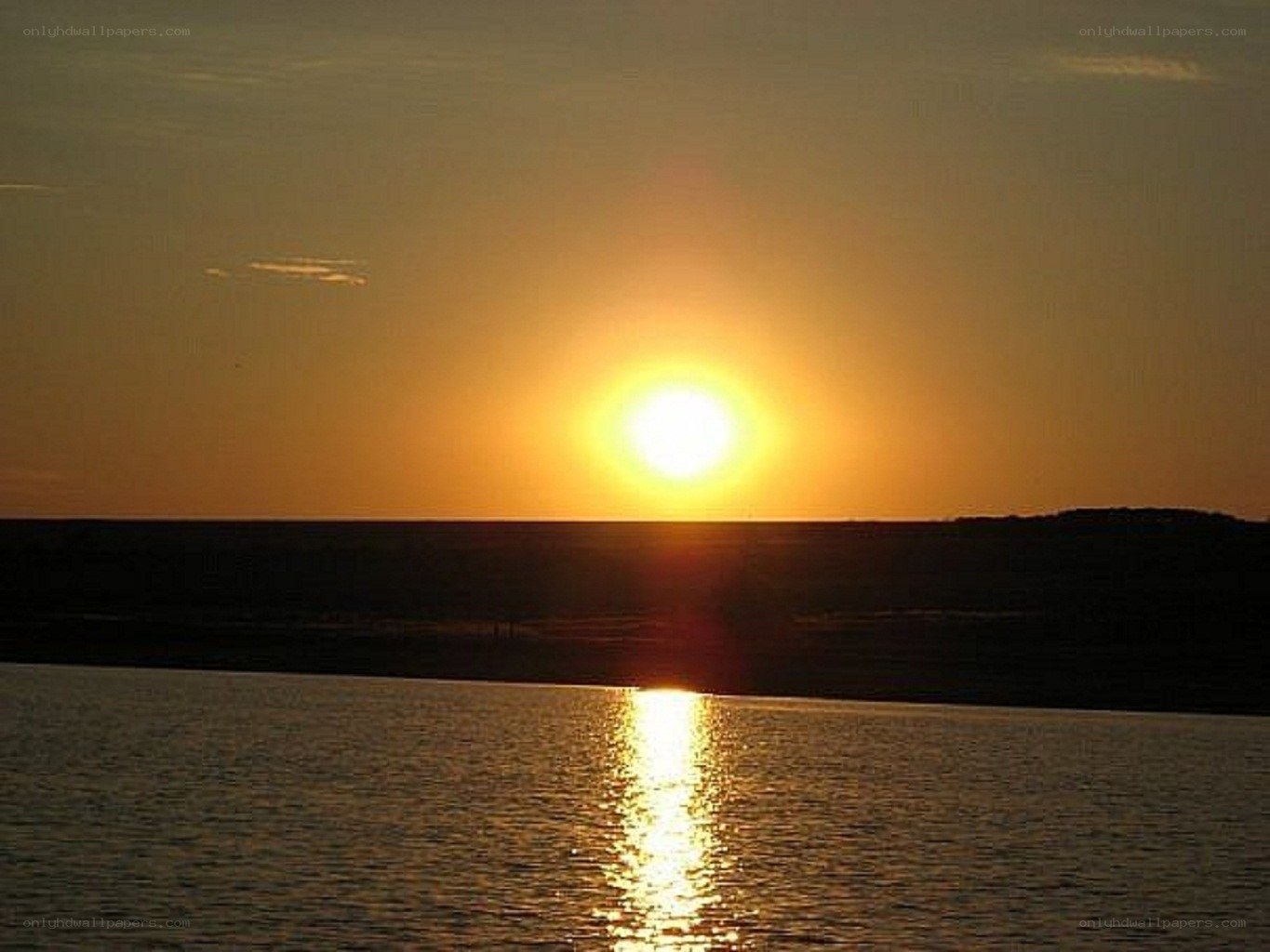 Sunset over calm water