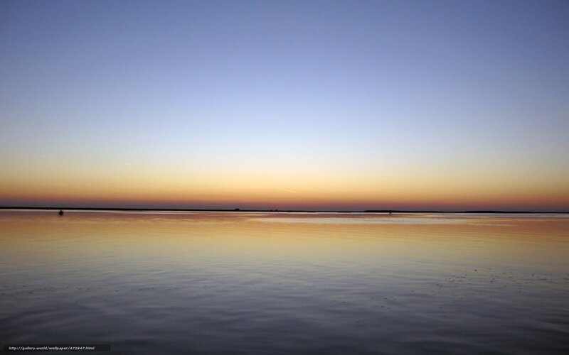 Sunset over calm water