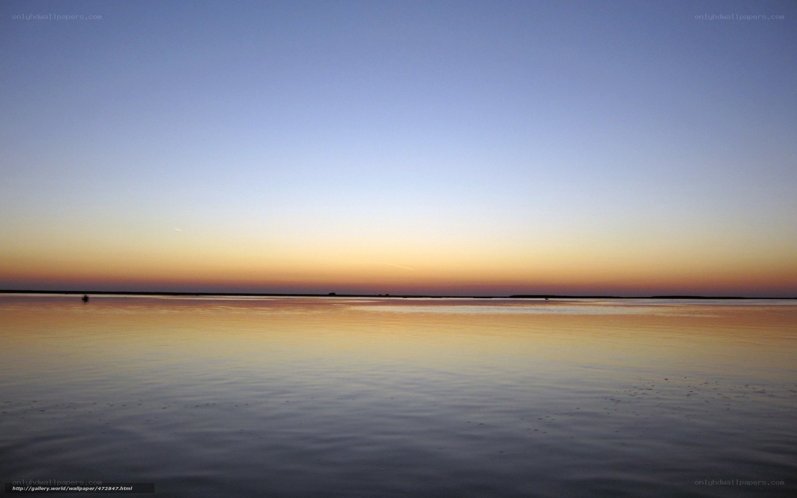 Sunset over calm water