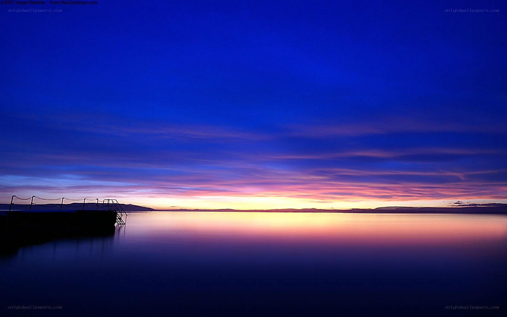 sunset over calm water