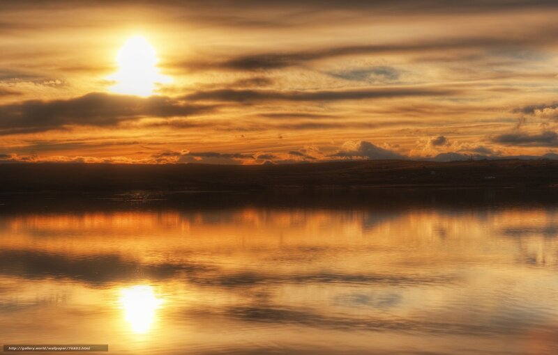 sunset over calm water