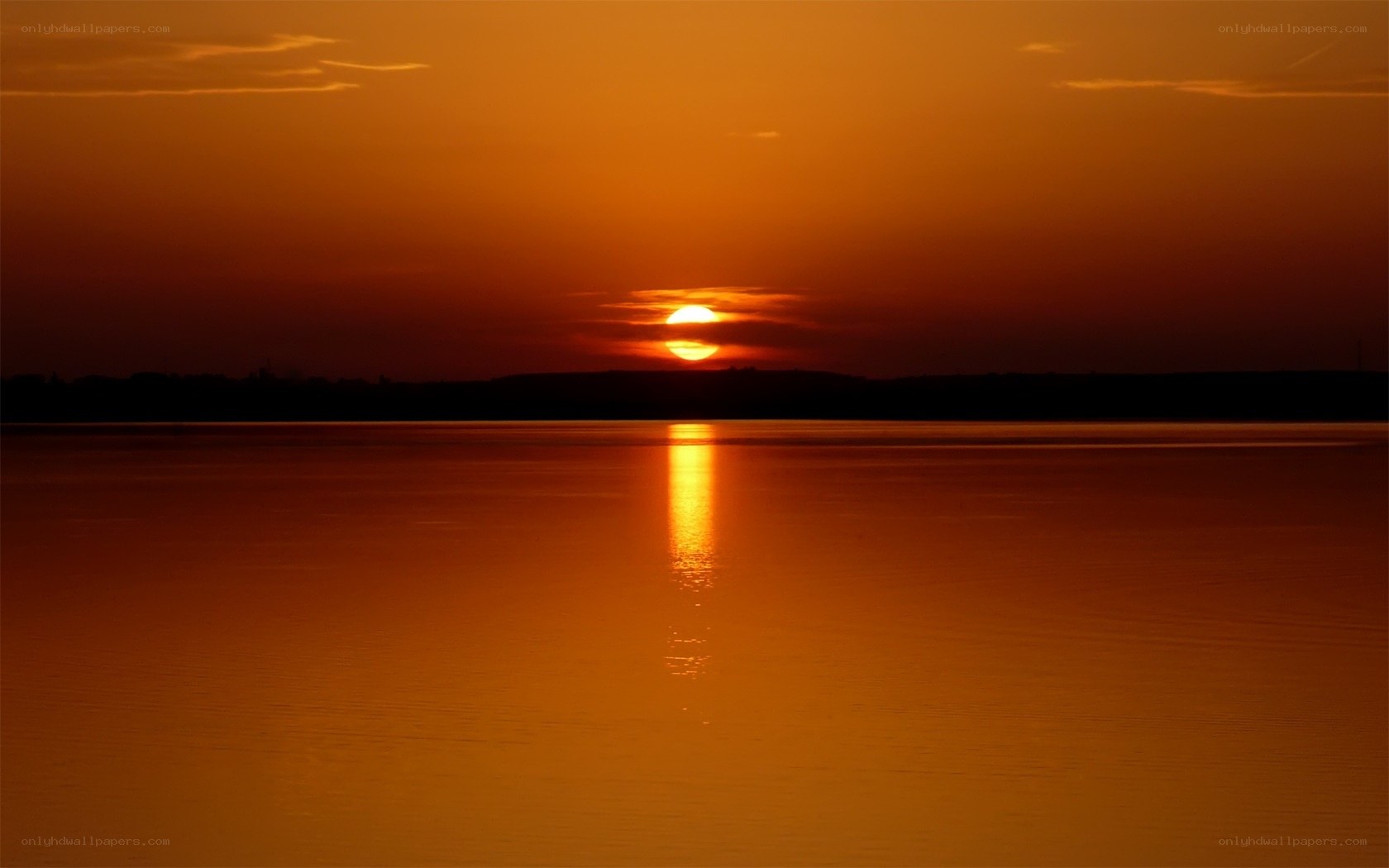 Sunset over calm water