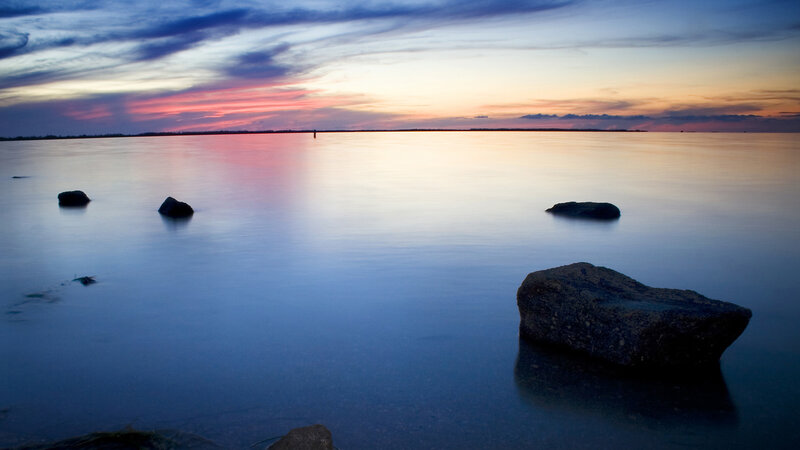 Sunset over calm water