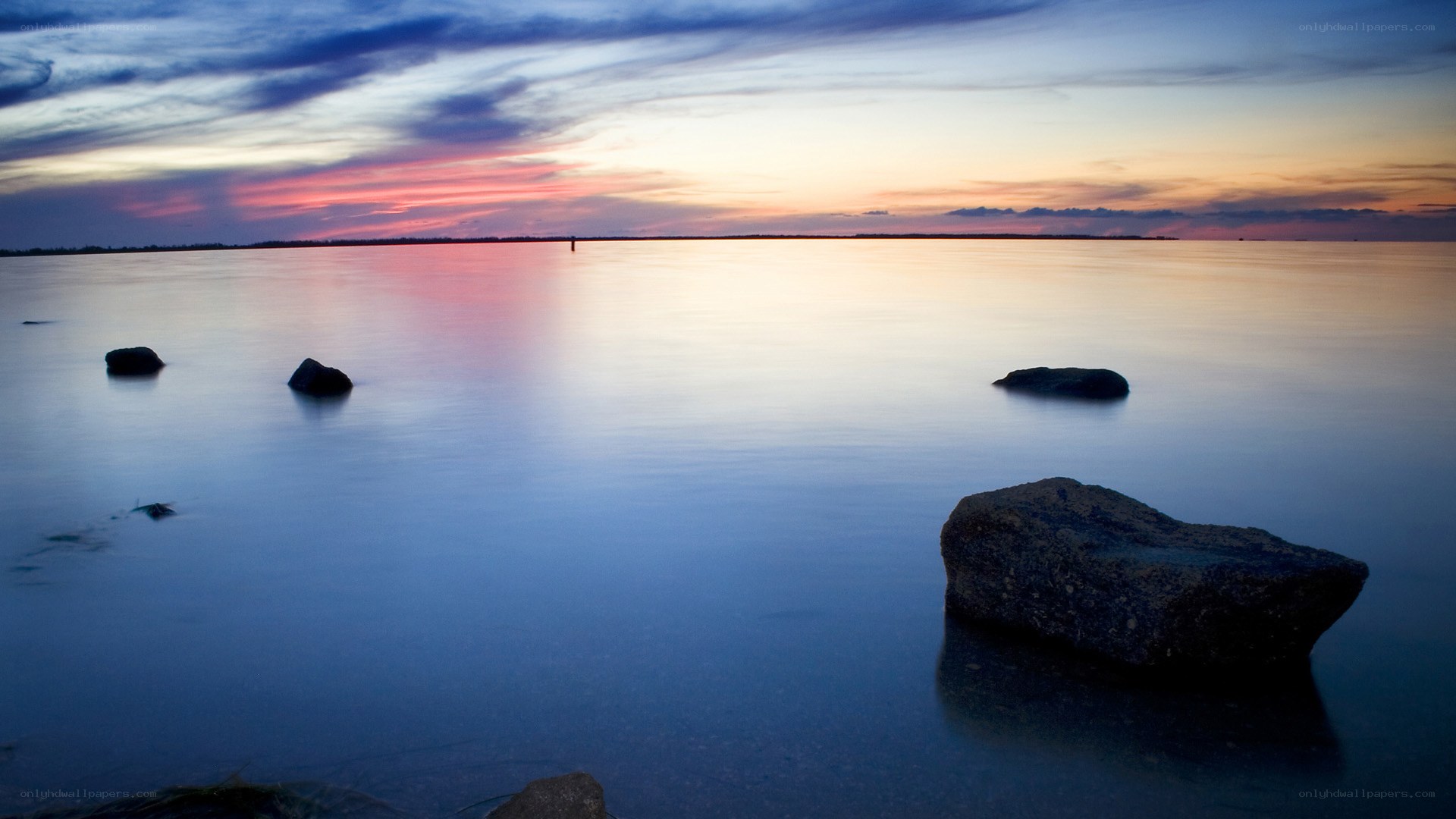 Sunset over calm water