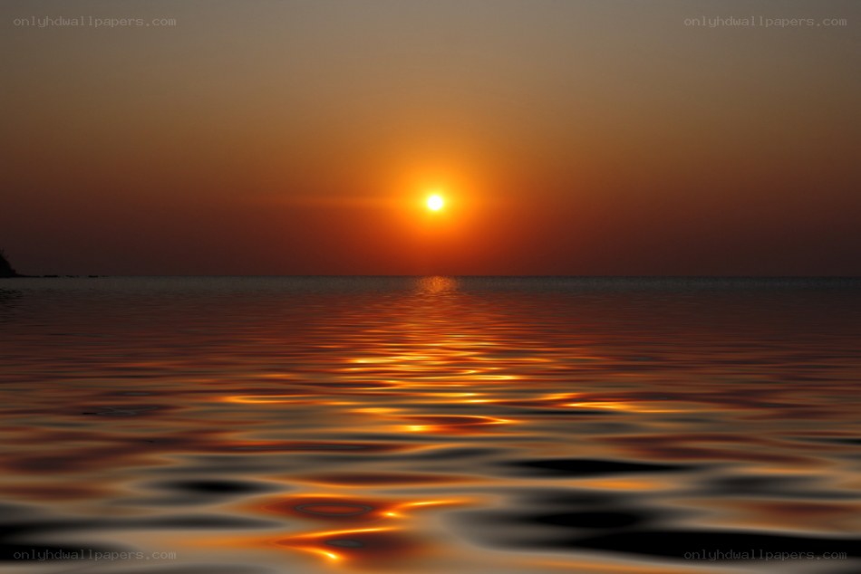 Sunset over calm water