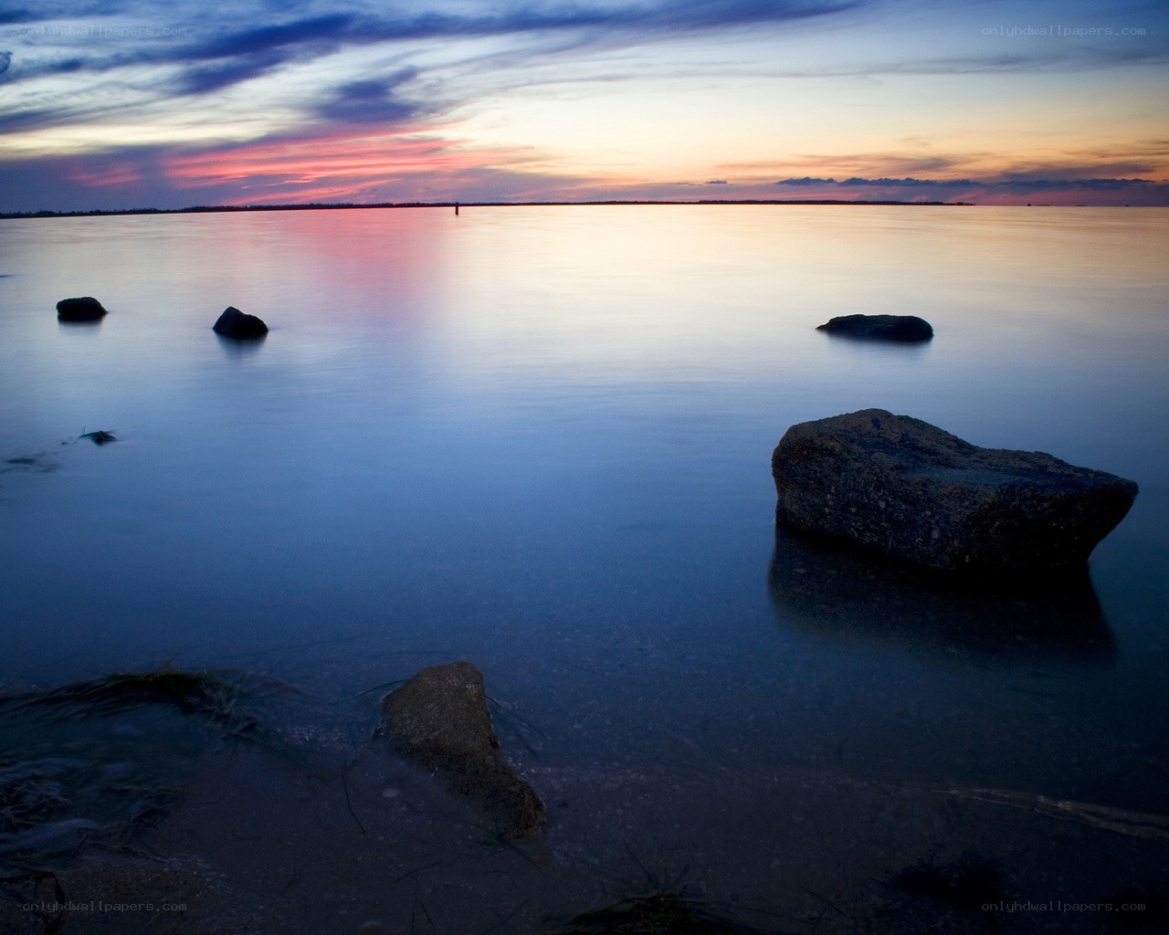 Sunset over calm water