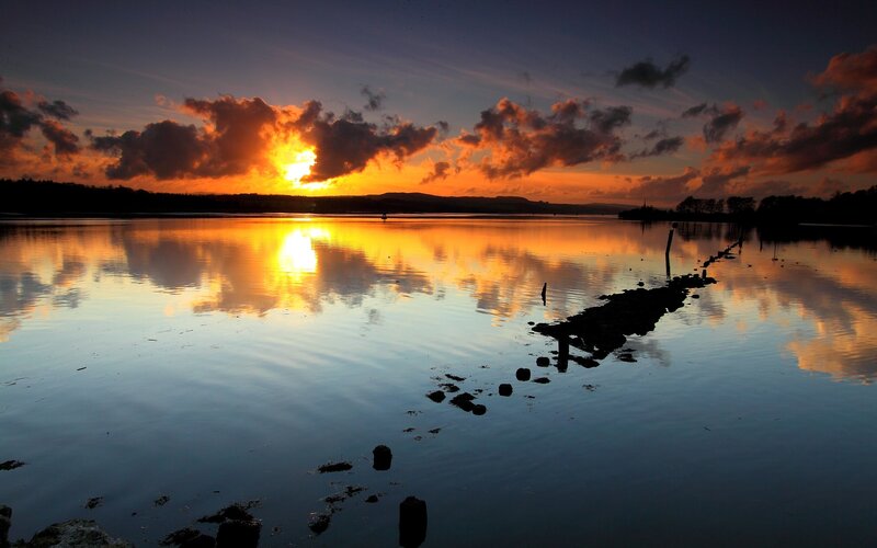 sunset over calm water