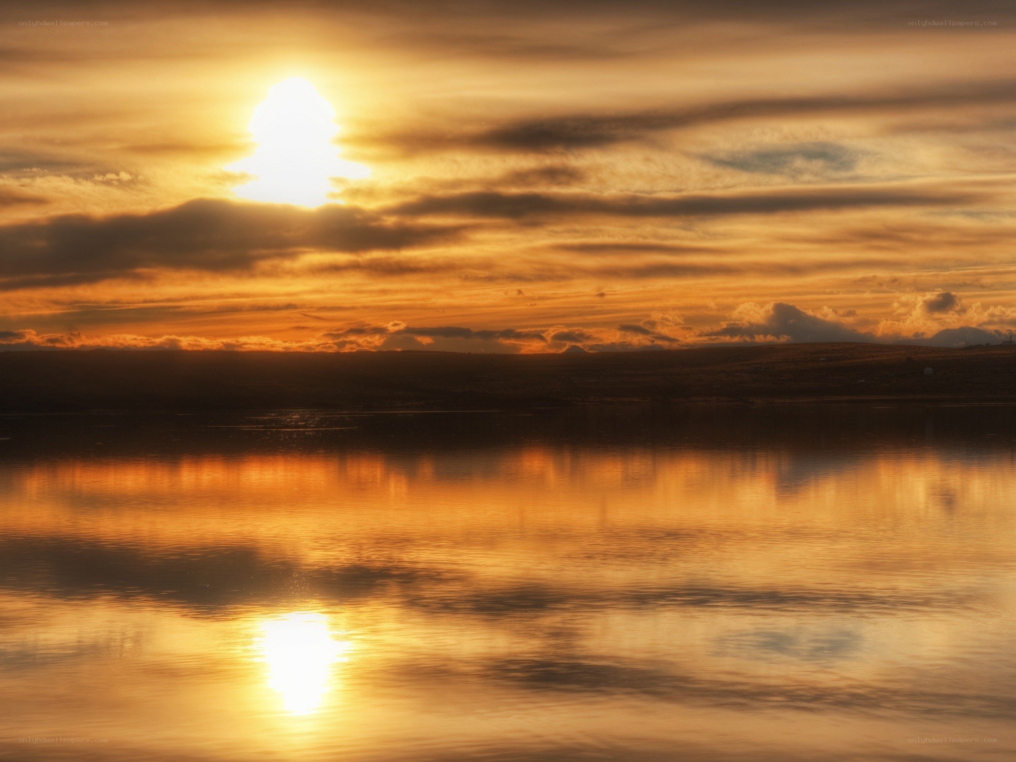 Sunset over calm water