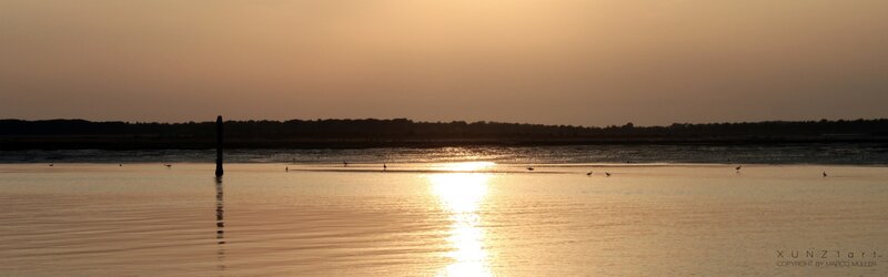 Sunset over calm water