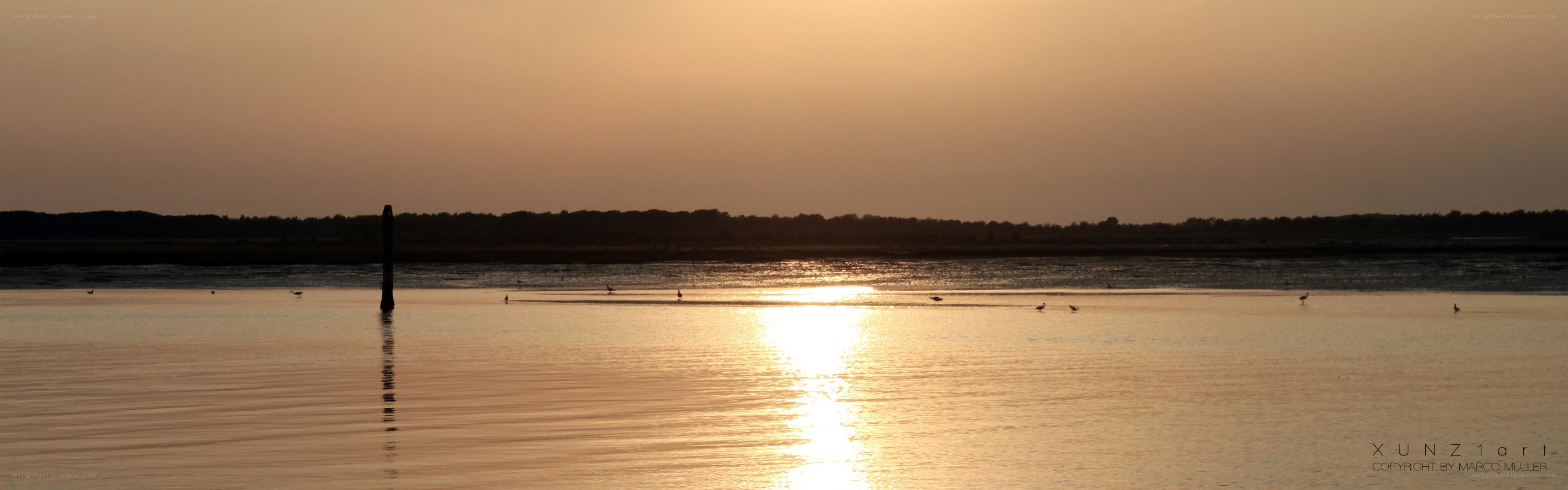 Sunset over calm water