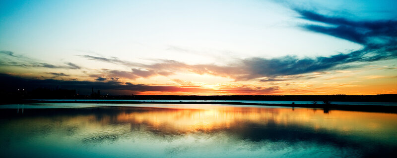sunset over calm water