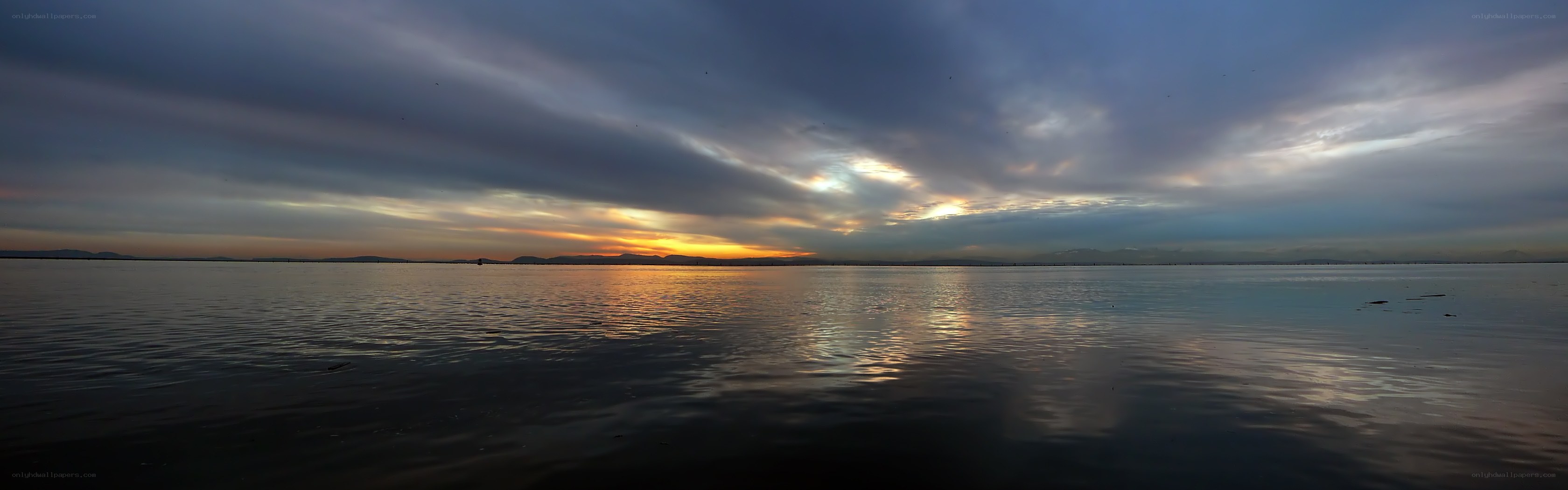Sunset over calm water