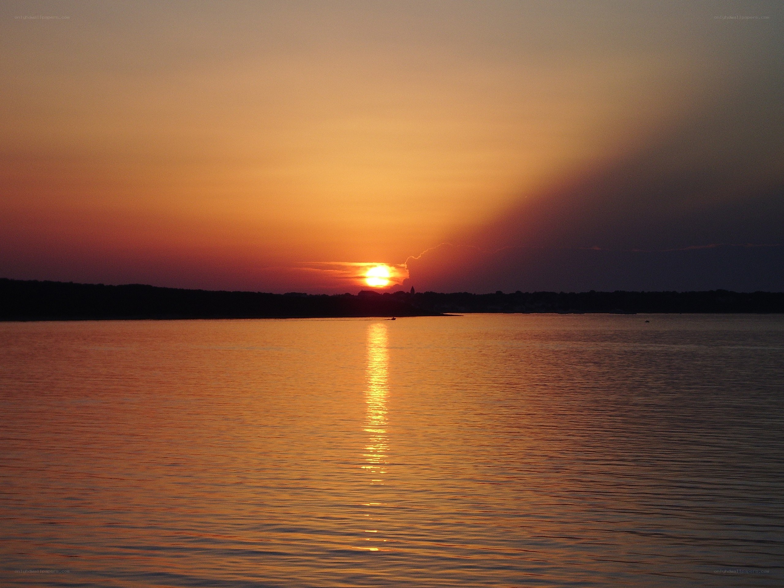 Sunset over calm water