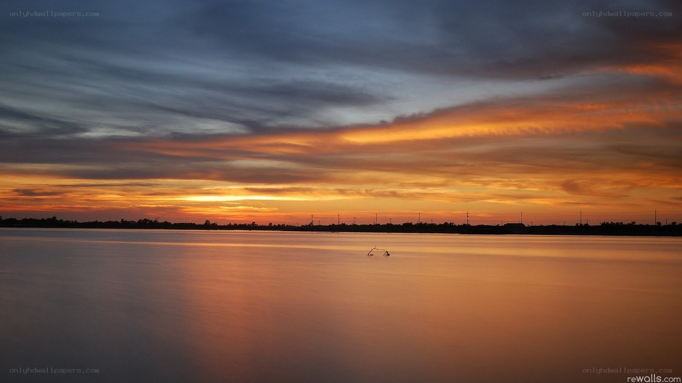 sunset over calm water