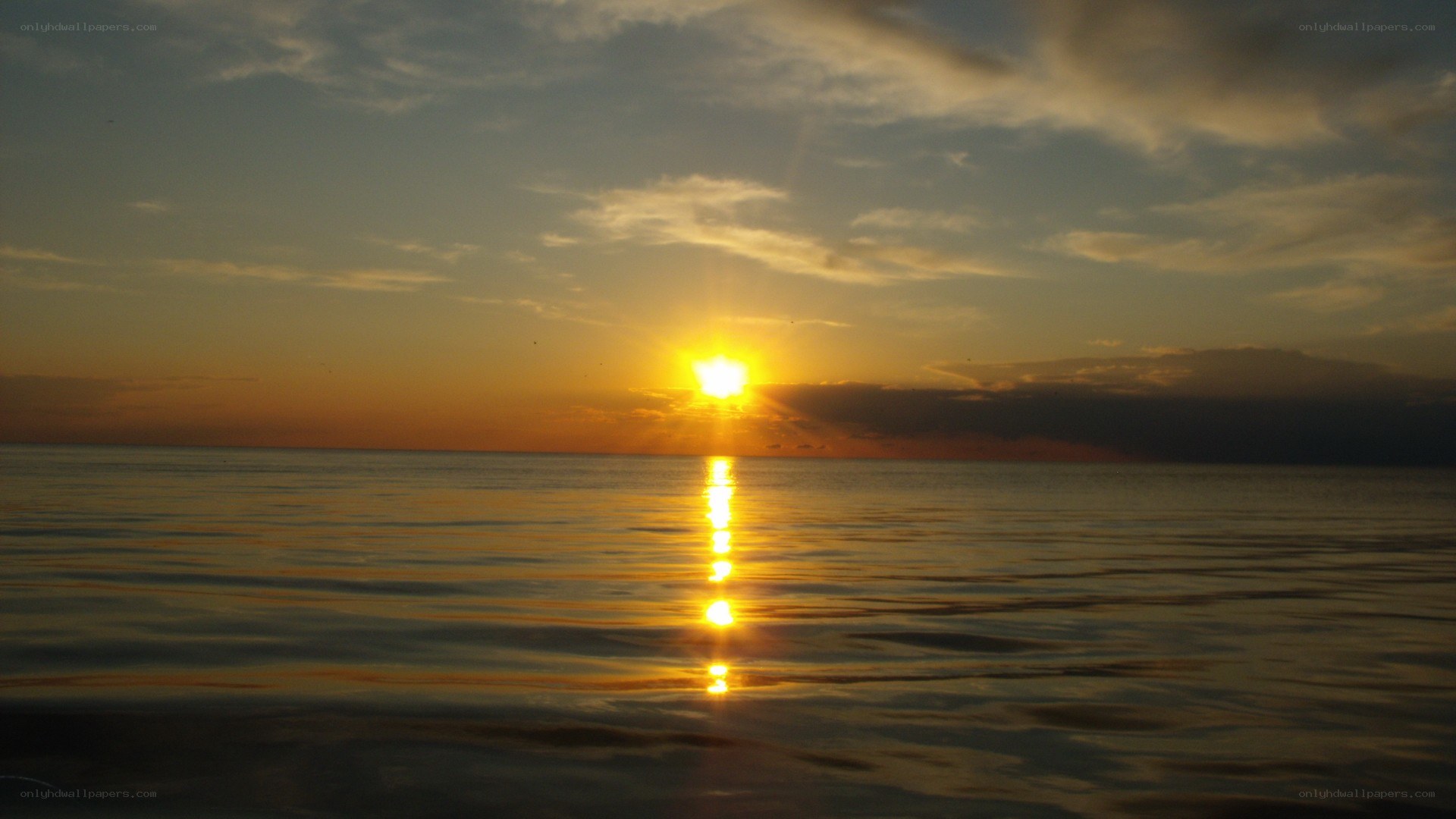 sunset over calm water