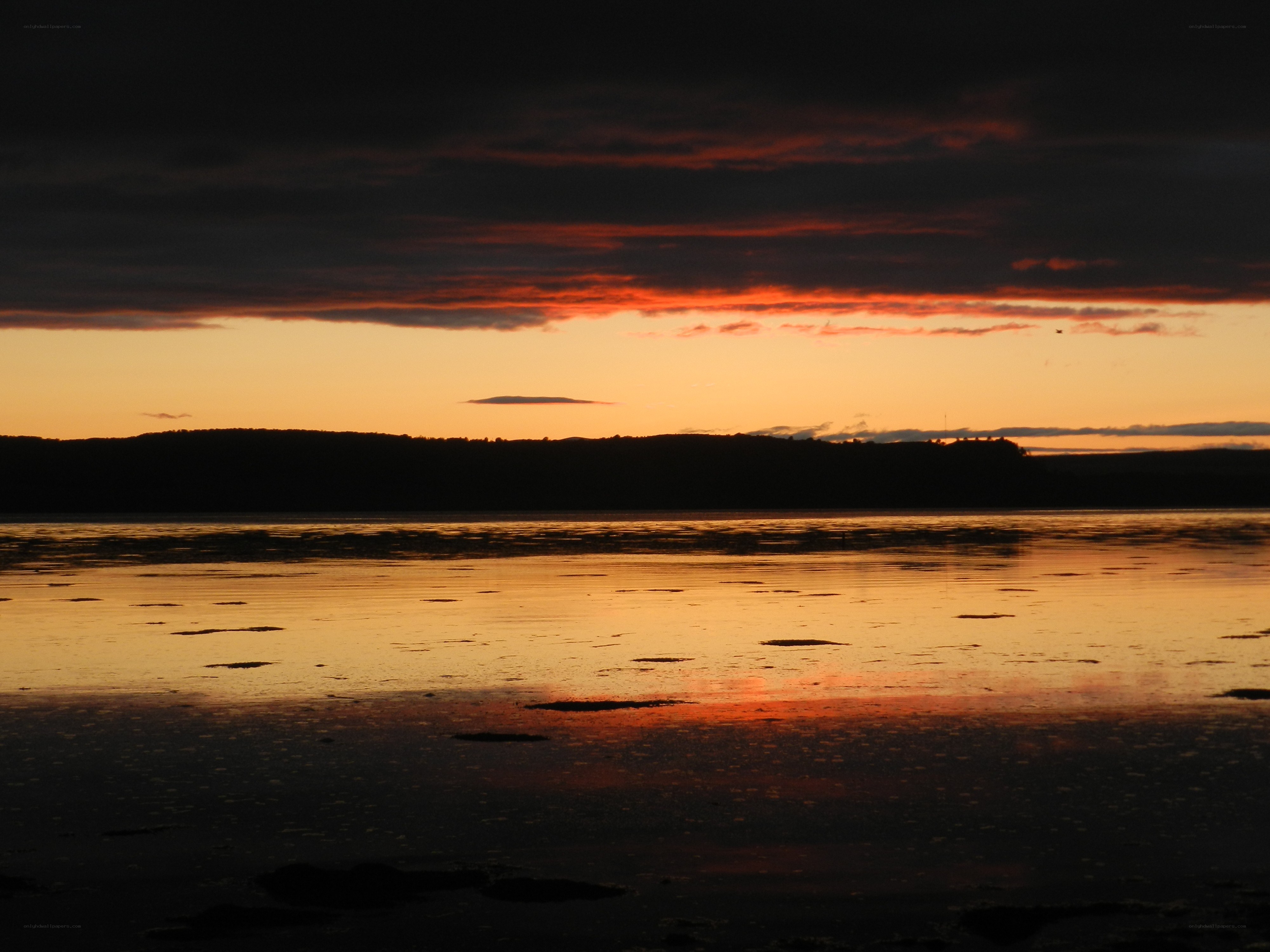 sunset over calm water