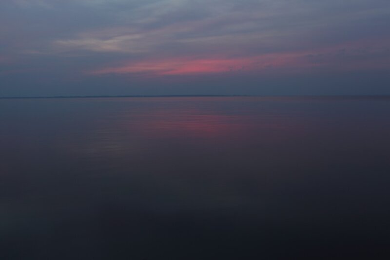 sunset over calm water