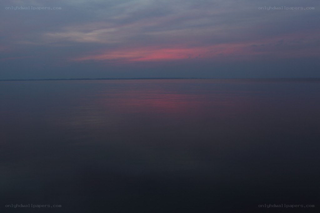 sunset over calm water