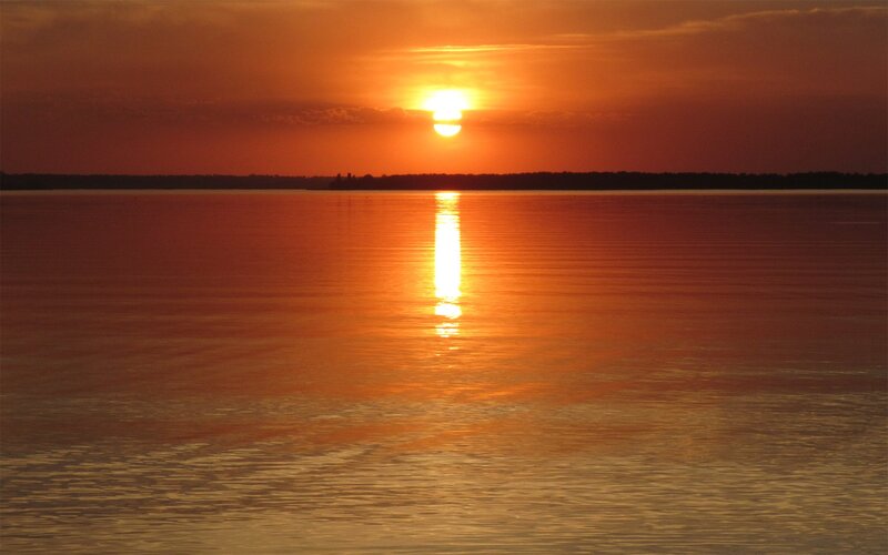 Sunset over calm water