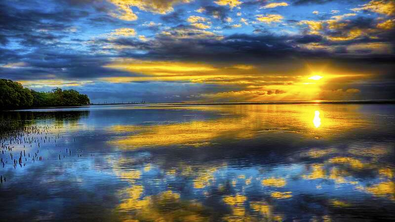 Sunset over Calm Water — Blue, Dramatic, Photograph, Clouds, Sun, Trees