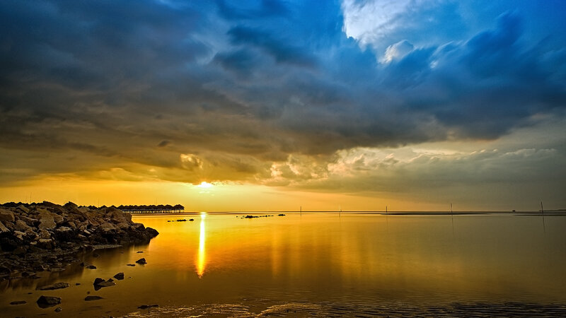 Sunset over Calm Water — Blue, Dramatic, Photograph, Rocks