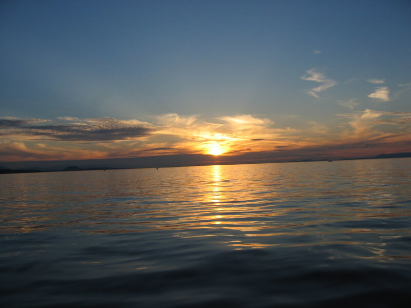 Sunset over Calm Water — Blue, Serene, Photograph, Sun, Clouds