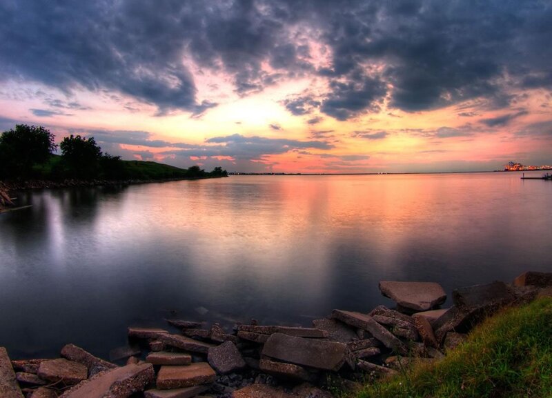 Sunset over Calm Water — Orange, Dramatic, Photograph, Clouds, Rocks, Trees