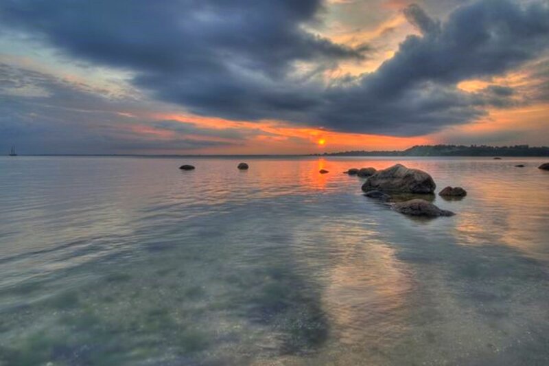 Sunset over Calm Water — Orange, Dramatic, Photograph, Rocks, Clouds