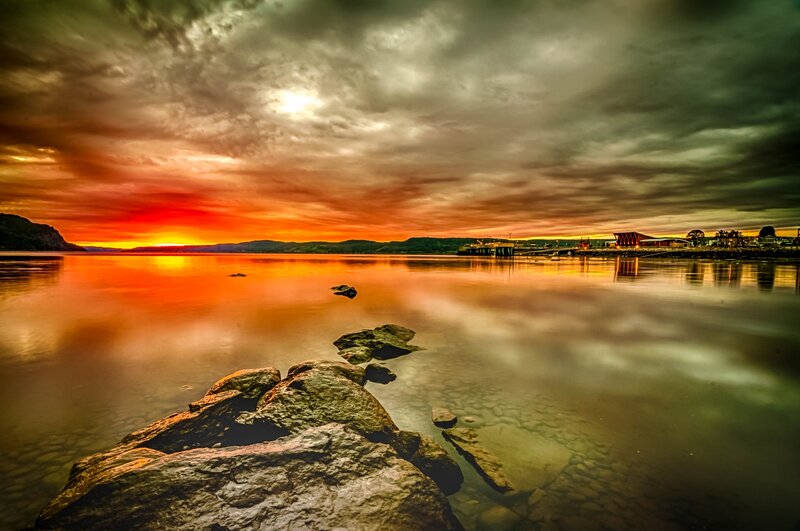 Sunset over Calm Water — Orange, Dramatic, Photograph, Rocks, Mountains