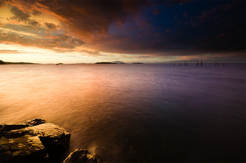 Sunset over Calm Water — Orange, Dramatic, Photograph, Rocks