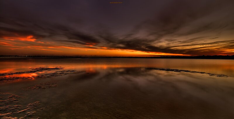 Sunset over Calm Water — Orange, Dramatic