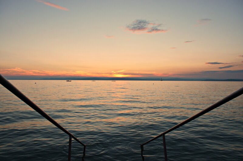 Sunset over Calm Water — Orange, Serene, Photograph, Boats