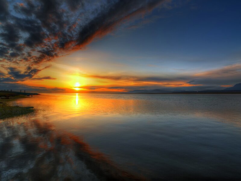 Sunset over Calm Water — Orange, Serene, Photograph, Clouds, Mountains, Shoreline