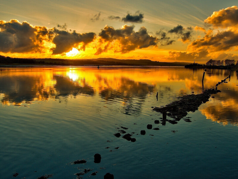Sunset over Calm Water — Orange, Serene, Photograph, Clouds, Reflection, Rocks
