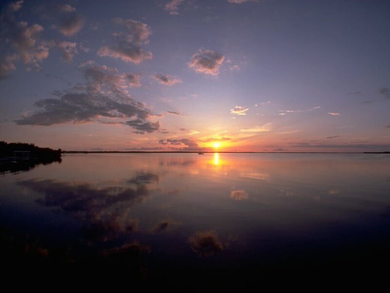 Sunset over Calm Water — Orange, Serene, Photograph, Sun, Clouds, Reflection