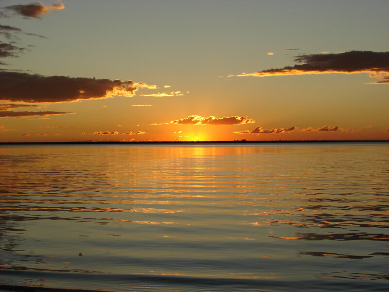 Sunset over Calm Water — Orange, Serene, Photograph, Sun