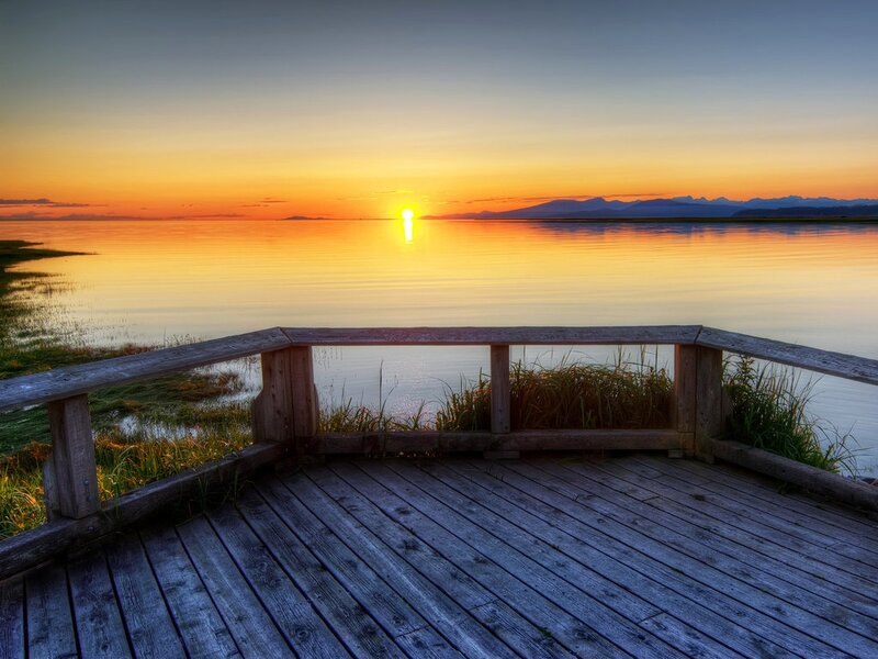 Sunset over Calm Water — Orange, Serene, Photograph, Wooden Deck