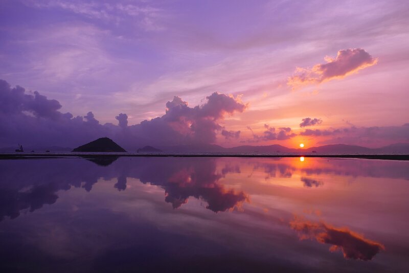 Sunset over Calm Water — Purple, Serene, Photograph, Clouds