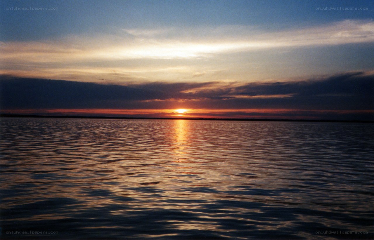Sunset over calm waters