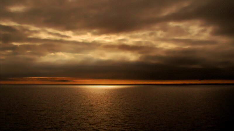 sunset over calm waters