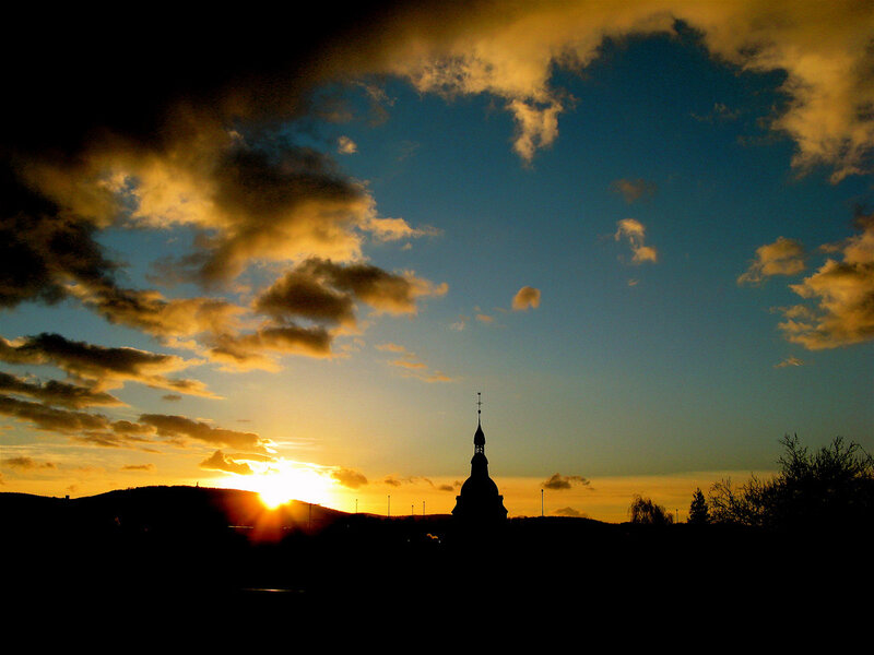 Sunset over church spire