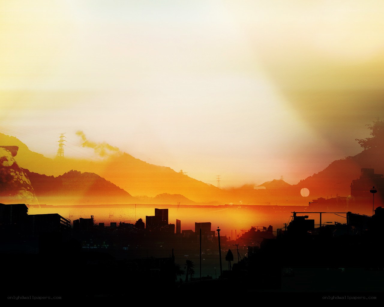 sunset over city and mountains