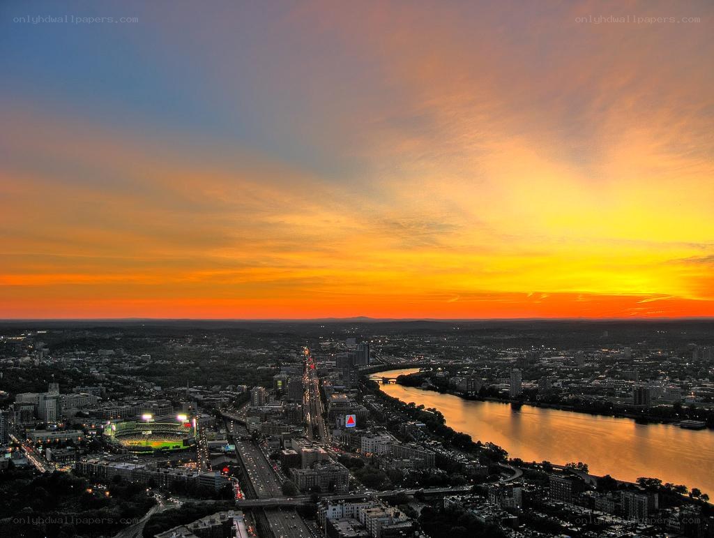 Sunset over city and river