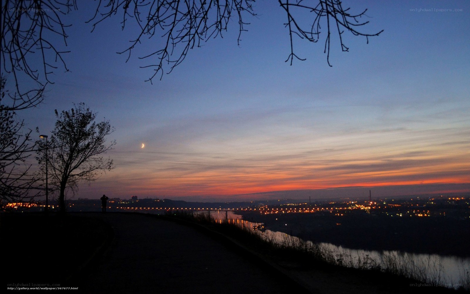 Sunset over city and river