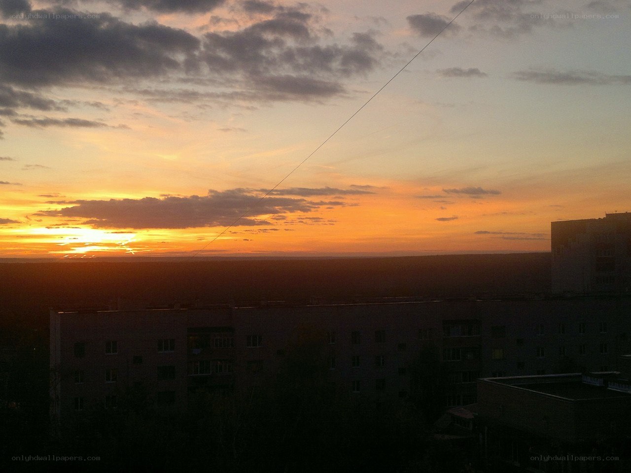 sunset over city buildings