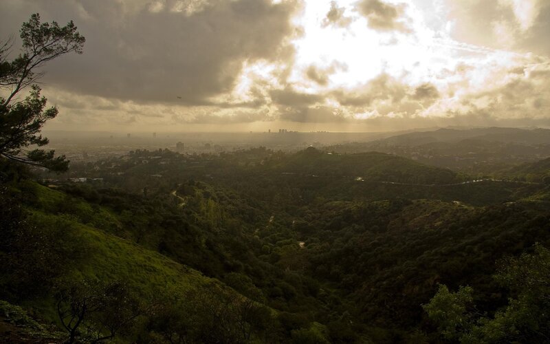 Sunset over city from hillside