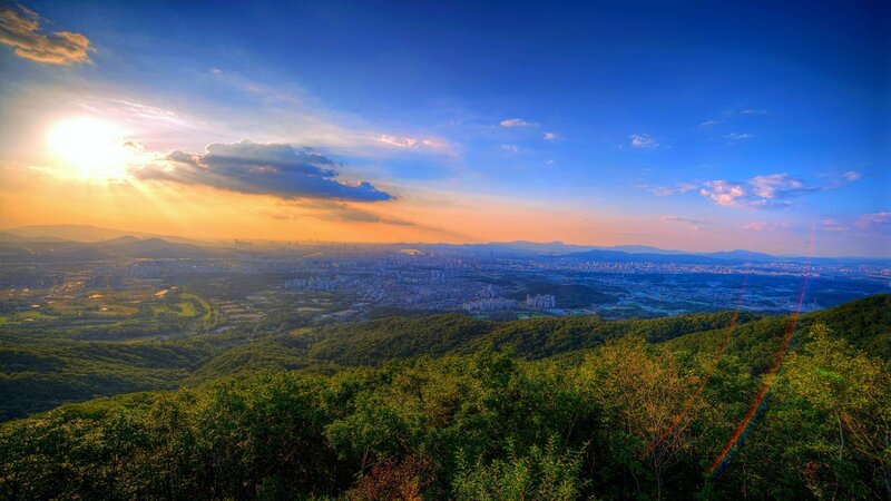 Sunset over city from mountain