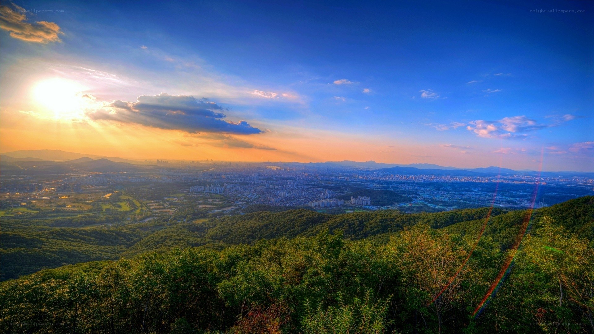Sunset over city from mountain