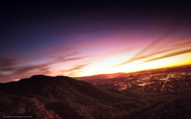 sunset over city from mountain